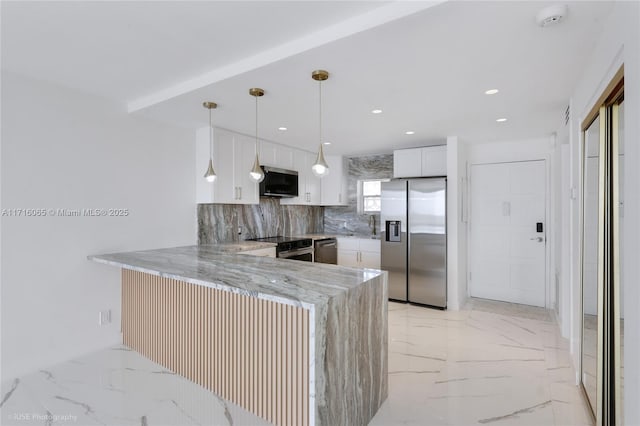 kitchen with kitchen peninsula, light stone countertops, stainless steel appliances, white cabinets, and hanging light fixtures