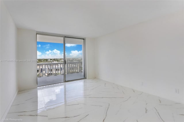 empty room featuring floor to ceiling windows