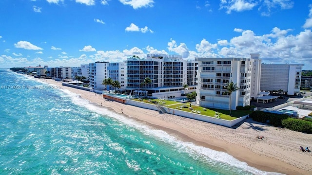 aerial view featuring a water view and a beach view