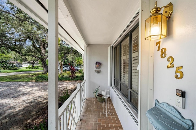 balcony featuring a porch