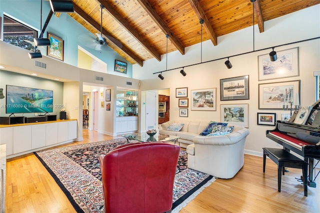 living room featuring beam ceiling, wood ceiling, high vaulted ceiling, and light hardwood / wood-style flooring