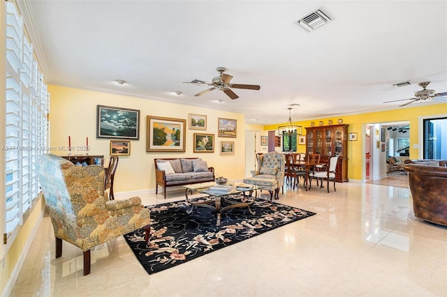 living room featuring ceiling fan and crown molding