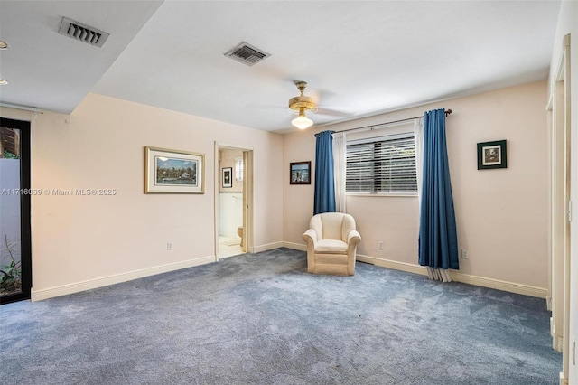 unfurnished room featuring dark carpet and ceiling fan