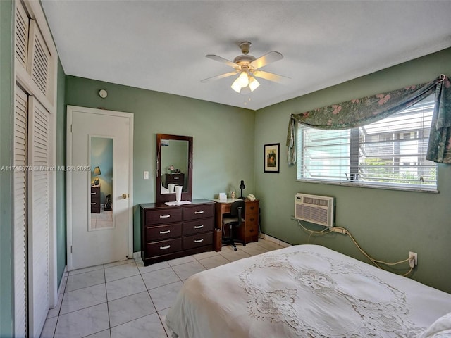 tiled bedroom with ceiling fan and a wall mounted air conditioner