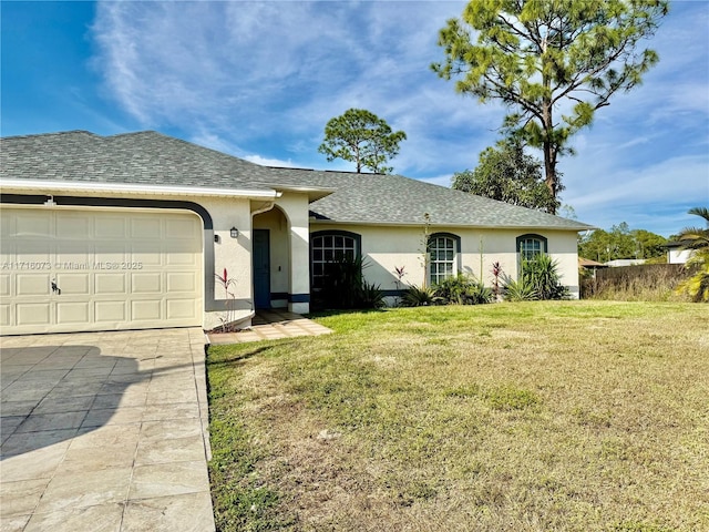 ranch-style house featuring a garage and a front lawn