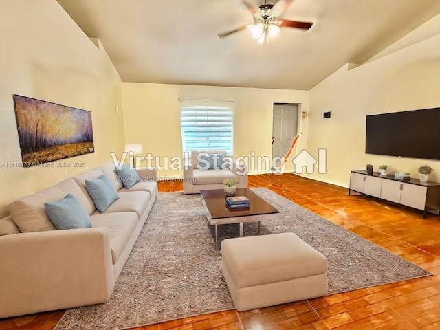 living room featuring hardwood / wood-style floors, ceiling fan, and vaulted ceiling