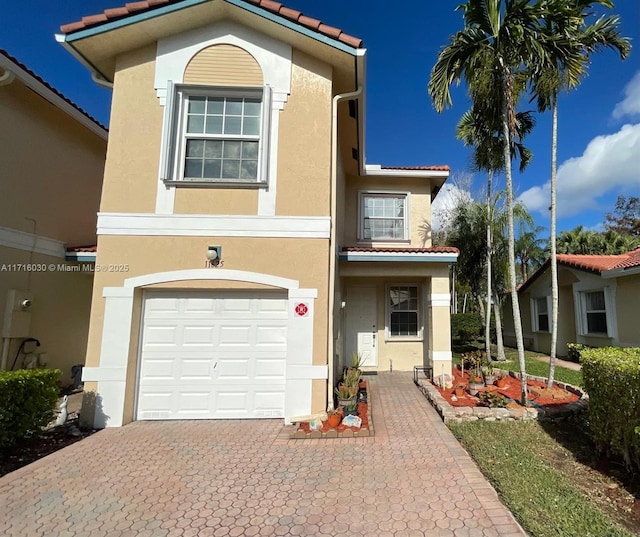 mediterranean / spanish-style home featuring a garage