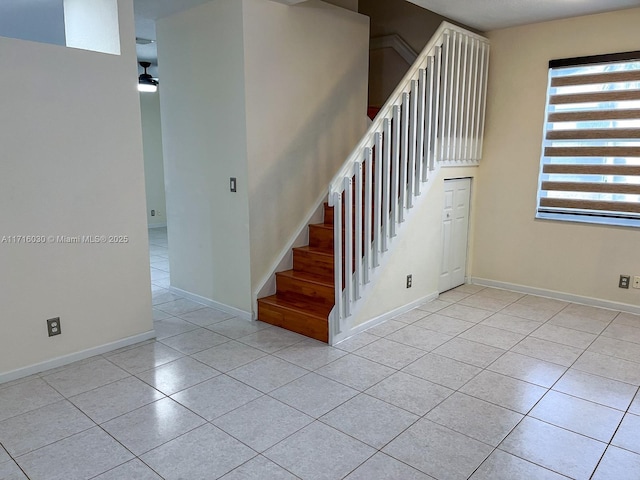 staircase featuring tile patterned floors