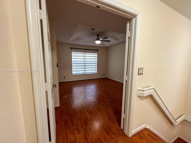 hall with wood-type flooring