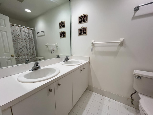 bathroom featuring tile patterned floors, vanity, toilet, and a shower with curtain