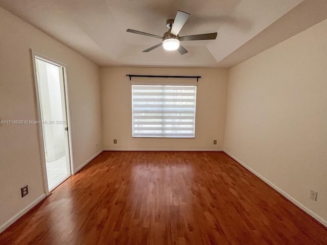 unfurnished room with hardwood / wood-style floors and ceiling fan