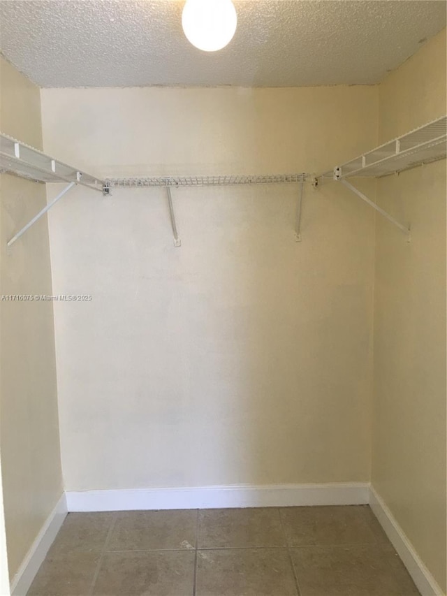 walk in closet featuring tile patterned floors