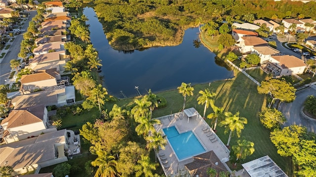 birds eye view of property with a water view