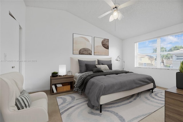 bedroom with lofted ceiling and ceiling fan