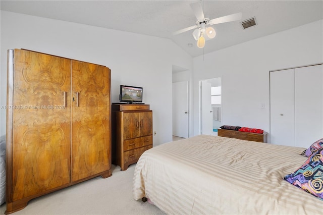 bedroom with vaulted ceiling, ceiling fan, and light carpet