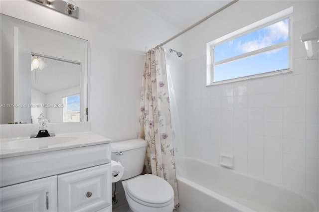 full bathroom featuring shower / tub combo with curtain, vanity, and toilet