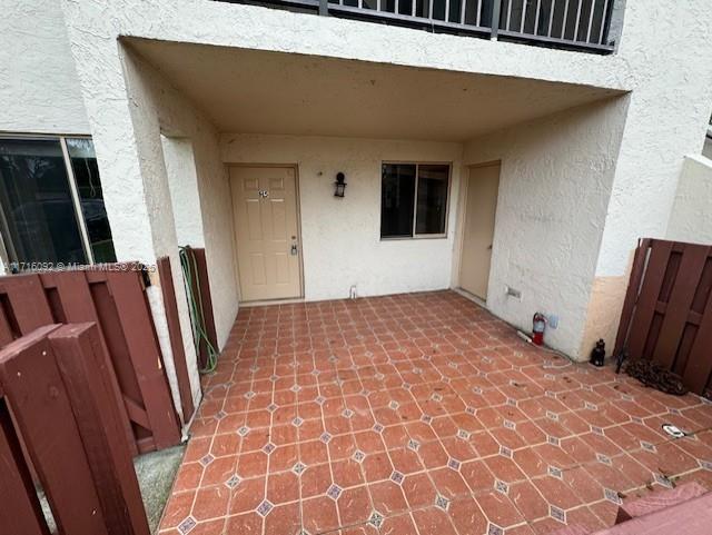 property entrance with a patio area