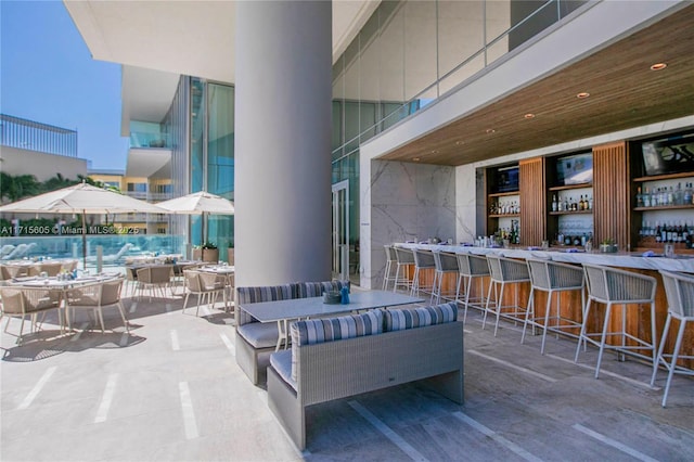 view of patio / terrace featuring outdoor lounge area and an outdoor bar