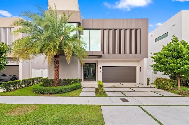 contemporary house featuring french doors and a garage