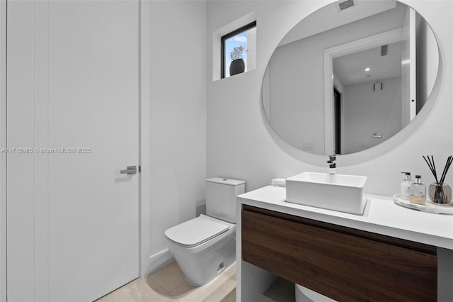 bathroom with vanity and toilet