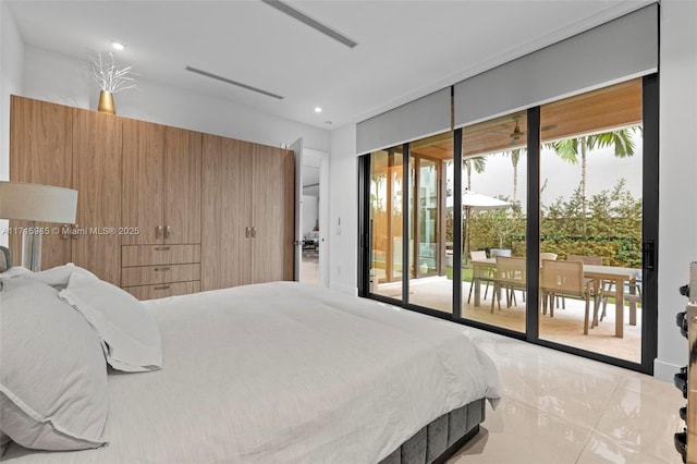 bedroom with light tile patterned flooring and access to outside