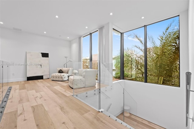 unfurnished living room featuring light wood-type flooring