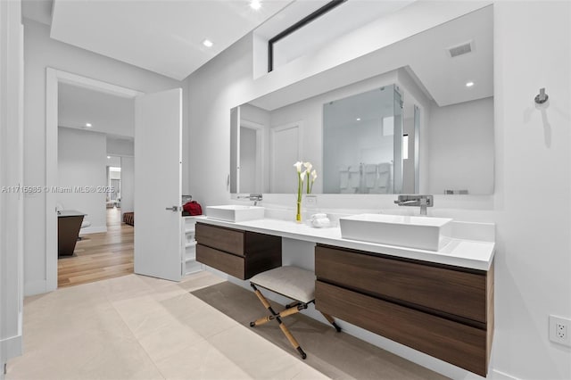 bathroom featuring tile patterned floors and vanity