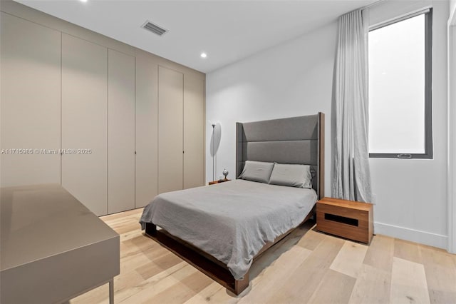 bedroom with light hardwood / wood-style flooring