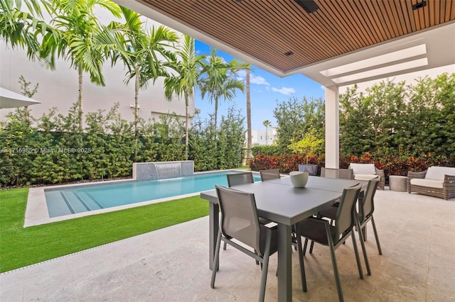 view of patio with pool water feature