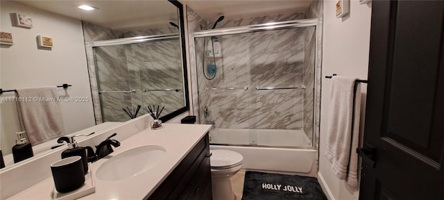 full bathroom featuring vanity, toilet, and bath / shower combo with glass door