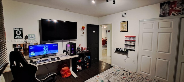 bedroom featuring dark wood-type flooring