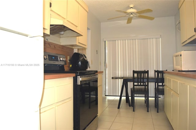 kitchen featuring a textured ceiling, white appliances, ceiling fan, and light tile patterned flooring