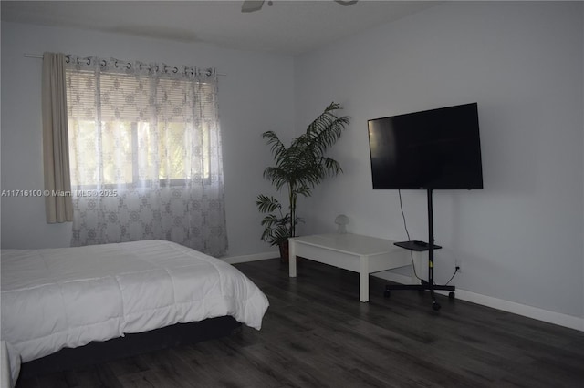 bedroom with ceiling fan and dark wood-type flooring