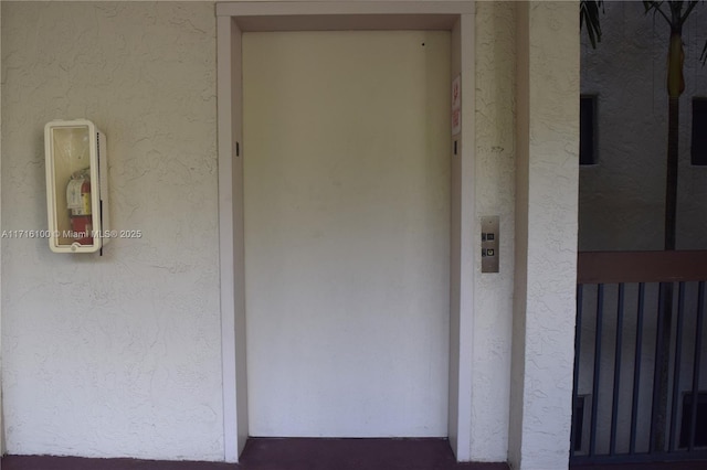 doorway to property with elevator