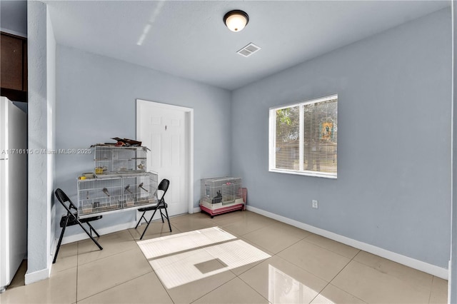 home office with light tile patterned floors