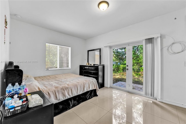 tiled bedroom featuring access to outside