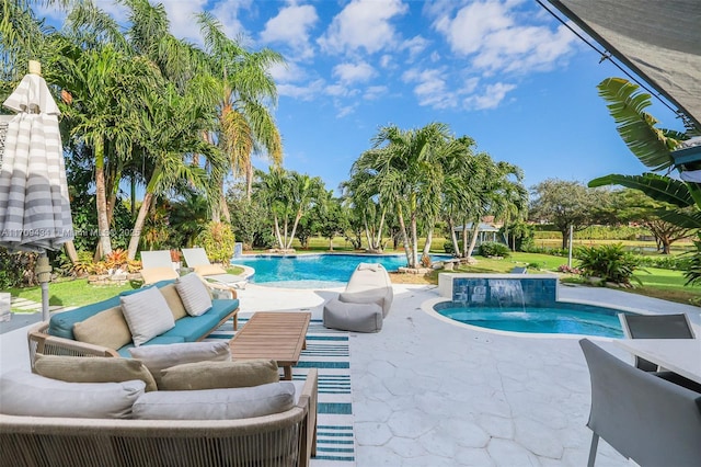 view of swimming pool featuring pool water feature and a patio