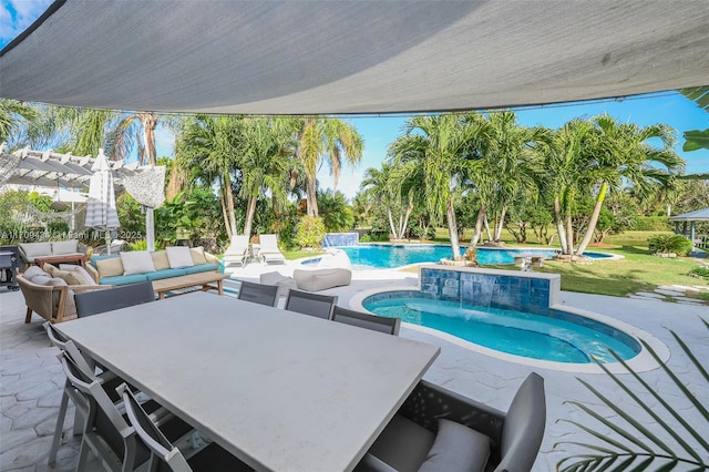 view of swimming pool with pool water feature, an outdoor living space, a pergola, and a patio area