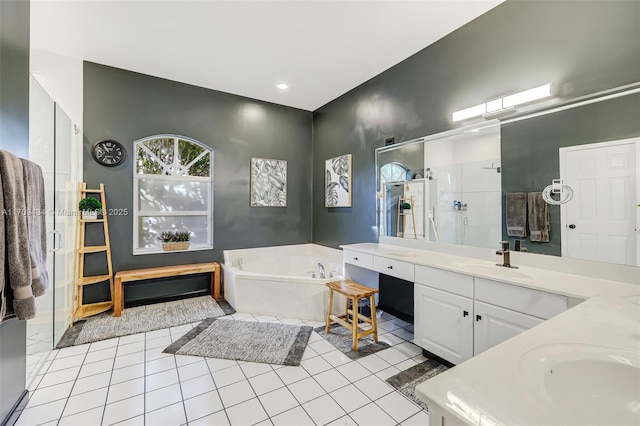 bathroom featuring vanity, independent shower and bath, and tile patterned flooring