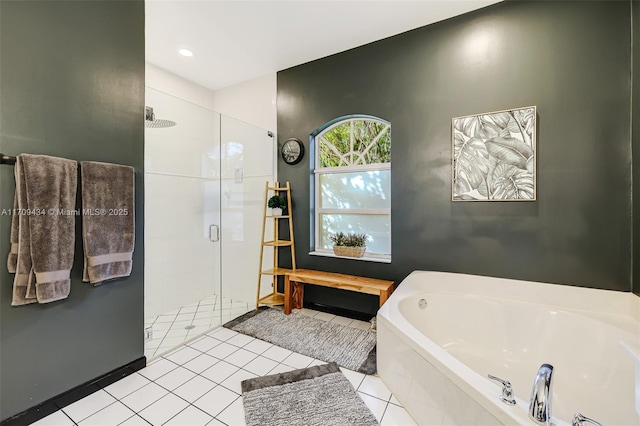 bathroom with shower with separate bathtub and tile patterned floors