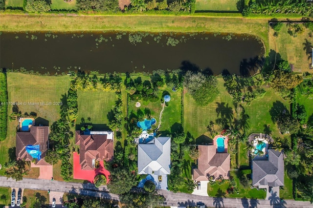 birds eye view of property featuring a water view