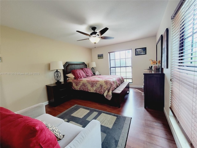 bedroom featuring ceiling fan and dark wood-type flooring