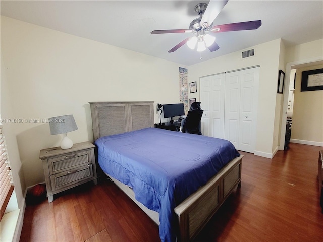 bedroom with a closet, ceiling fan, and dark hardwood / wood-style floors