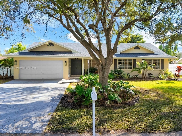 single story home featuring a garage and a front yard