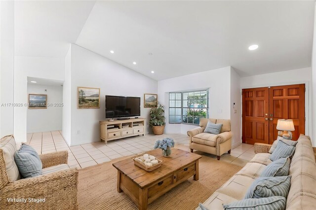 empty room featuring light tile patterned floors and lofted ceiling