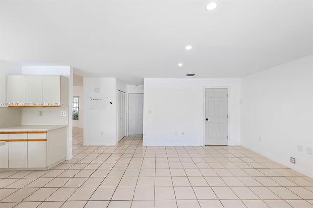 spare room with light tile patterned floors