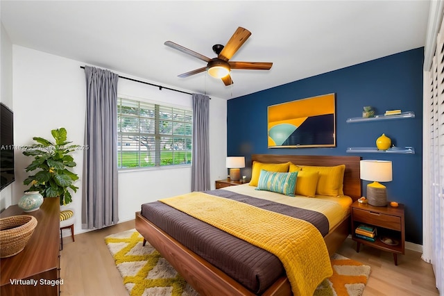 bedroom featuring ceiling fan and light wood-type flooring