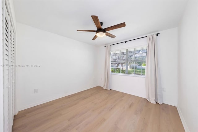 spare room with light hardwood / wood-style floors and ceiling fan