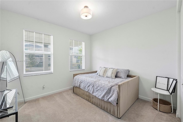 bedroom with light carpet