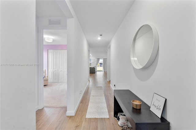 hallway featuring light wood-type flooring